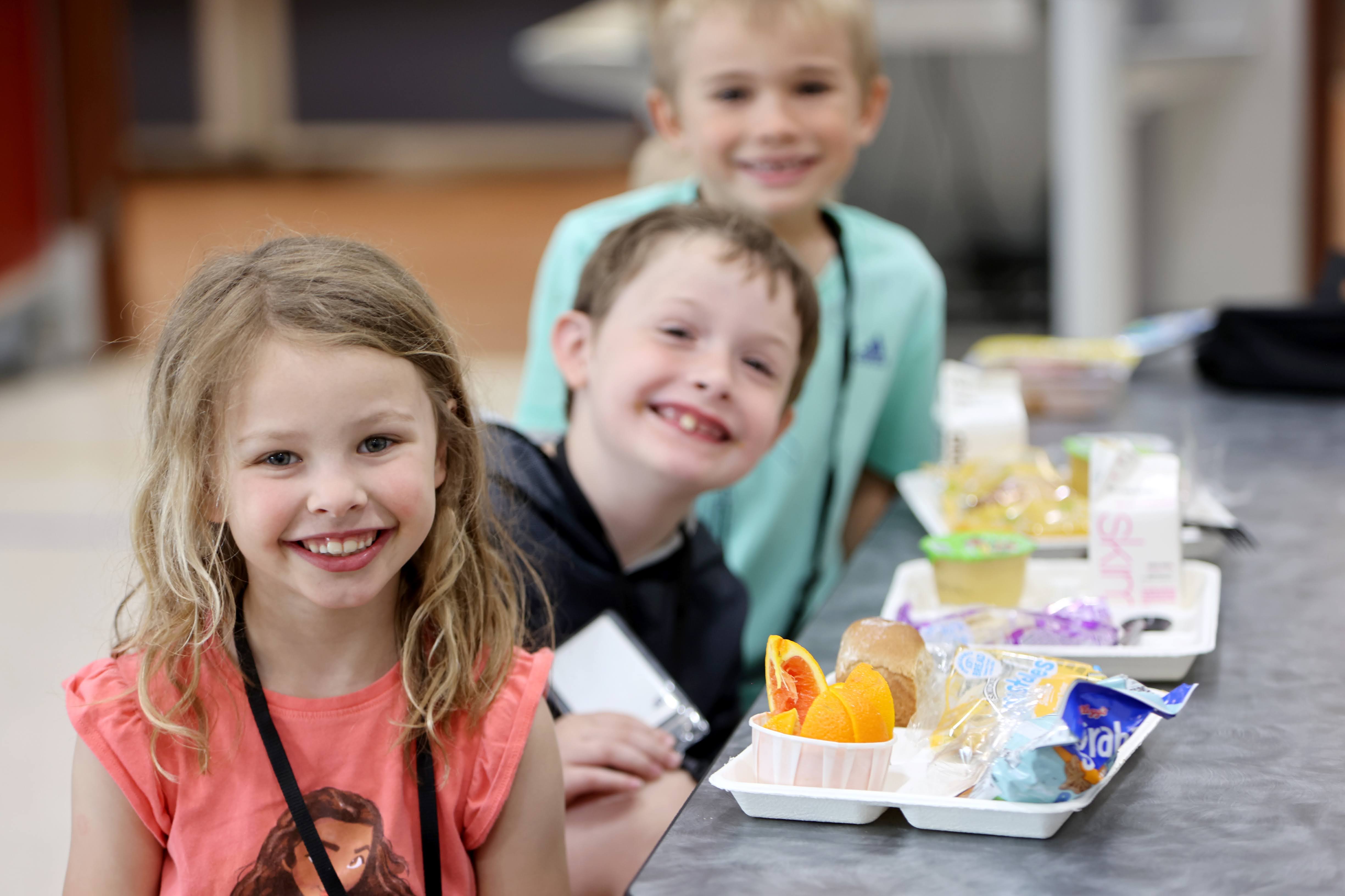 Centennial students sharing lunch in a school cafeteria